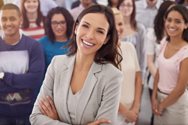 Smiling sales professional in a leadership position