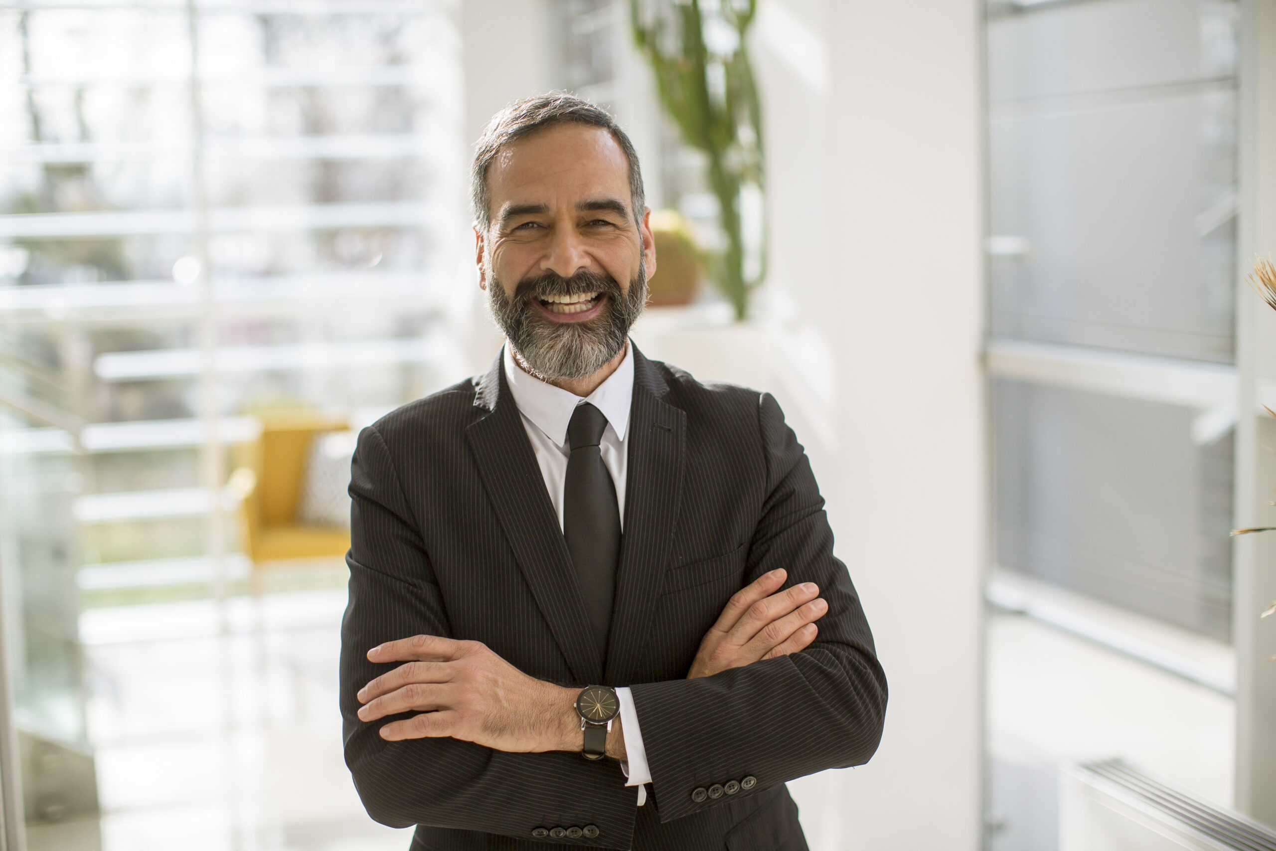 A highly paid sales director smiling